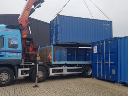 Crane delivering 20 foot container